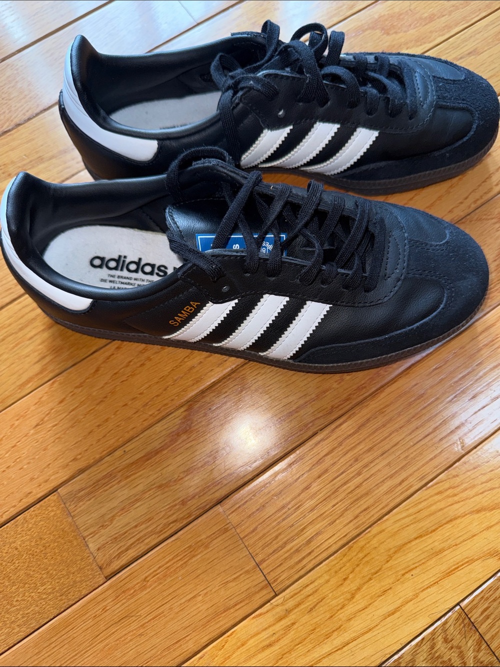 Adidas Black Sneakers with White Three-Stripes